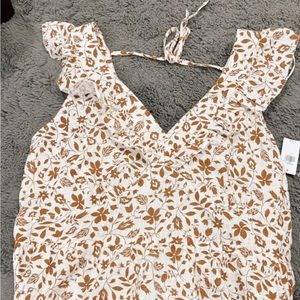 Woman’s brown and white blouse